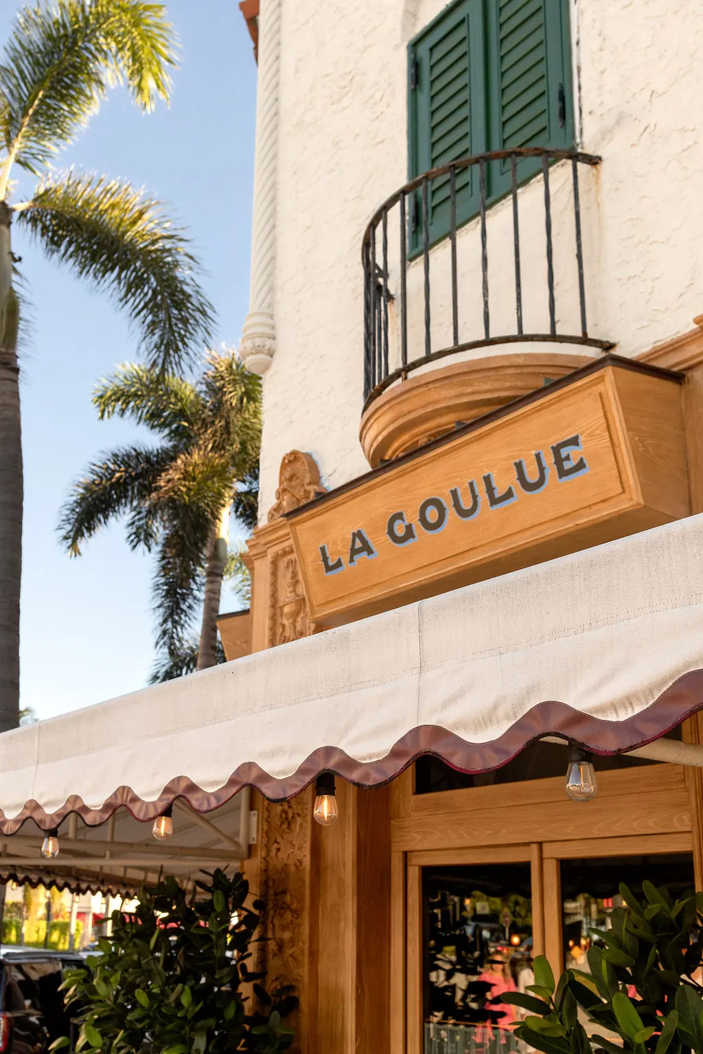 La Goulue on South County Road, Palm Beach, under the palms