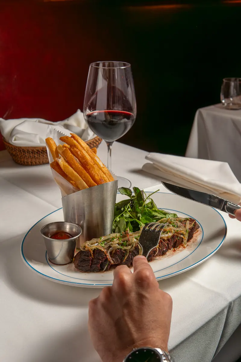 Steak Frites with a glass of red wine